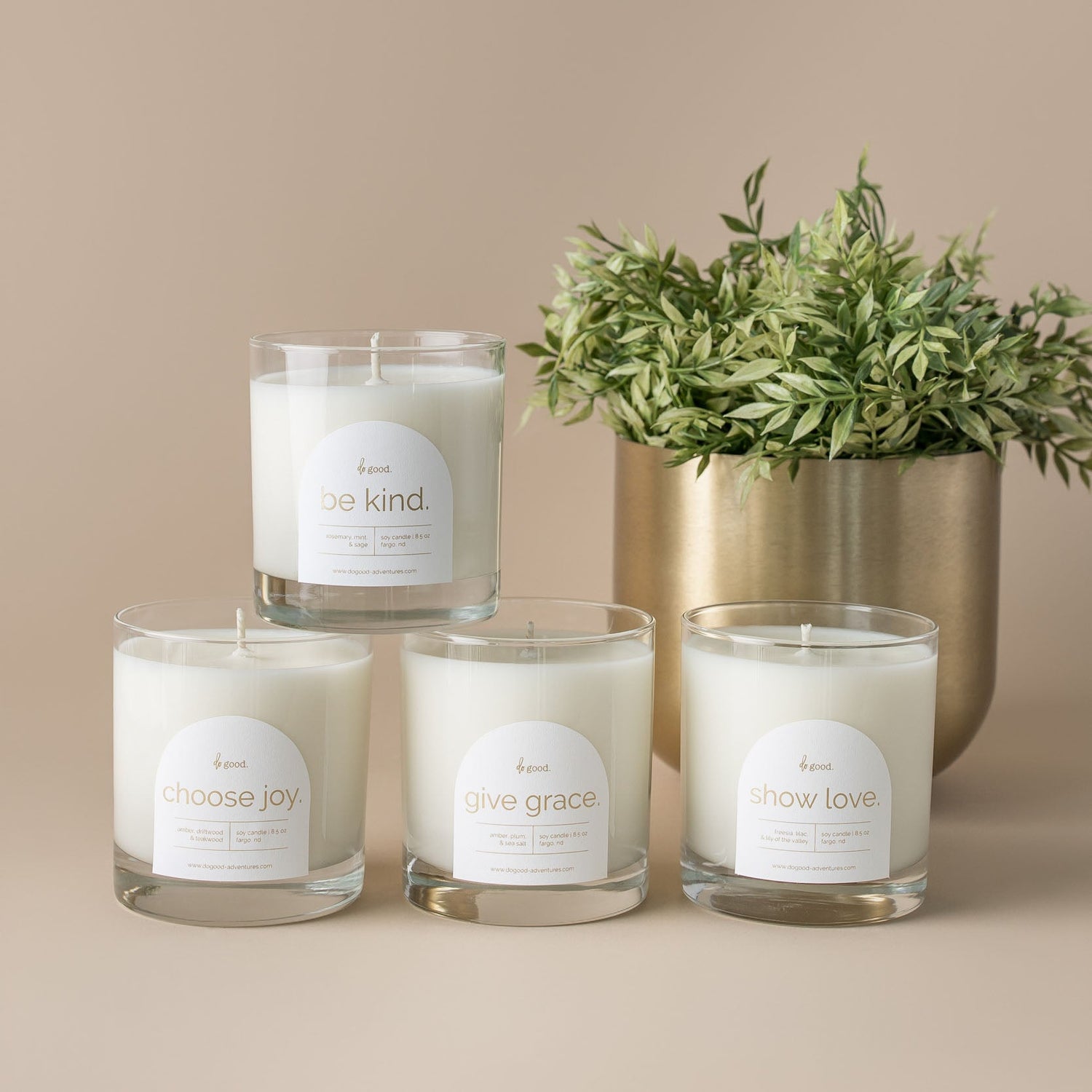 Image of the four candles in the do good collection: be kind./choose joy./give grace./show love.