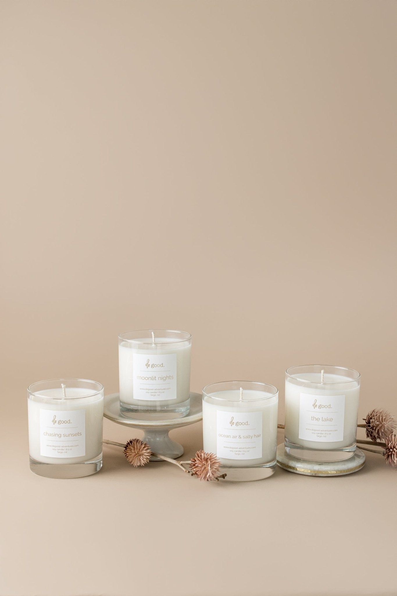 image of four soy candle in the summer collection:  chasing sunsets, moonlit nights, ocean aire & salty hair the lake
