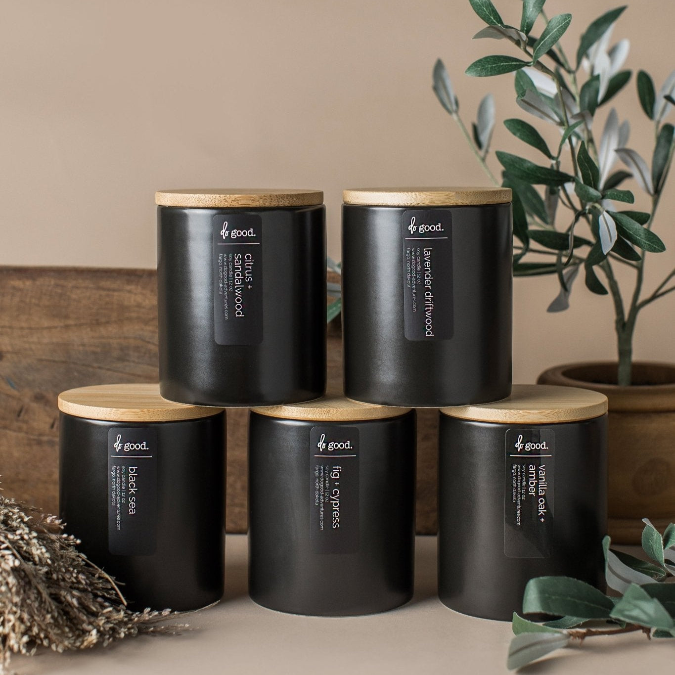 Styled image of five 12 ounce Black Signature Candles