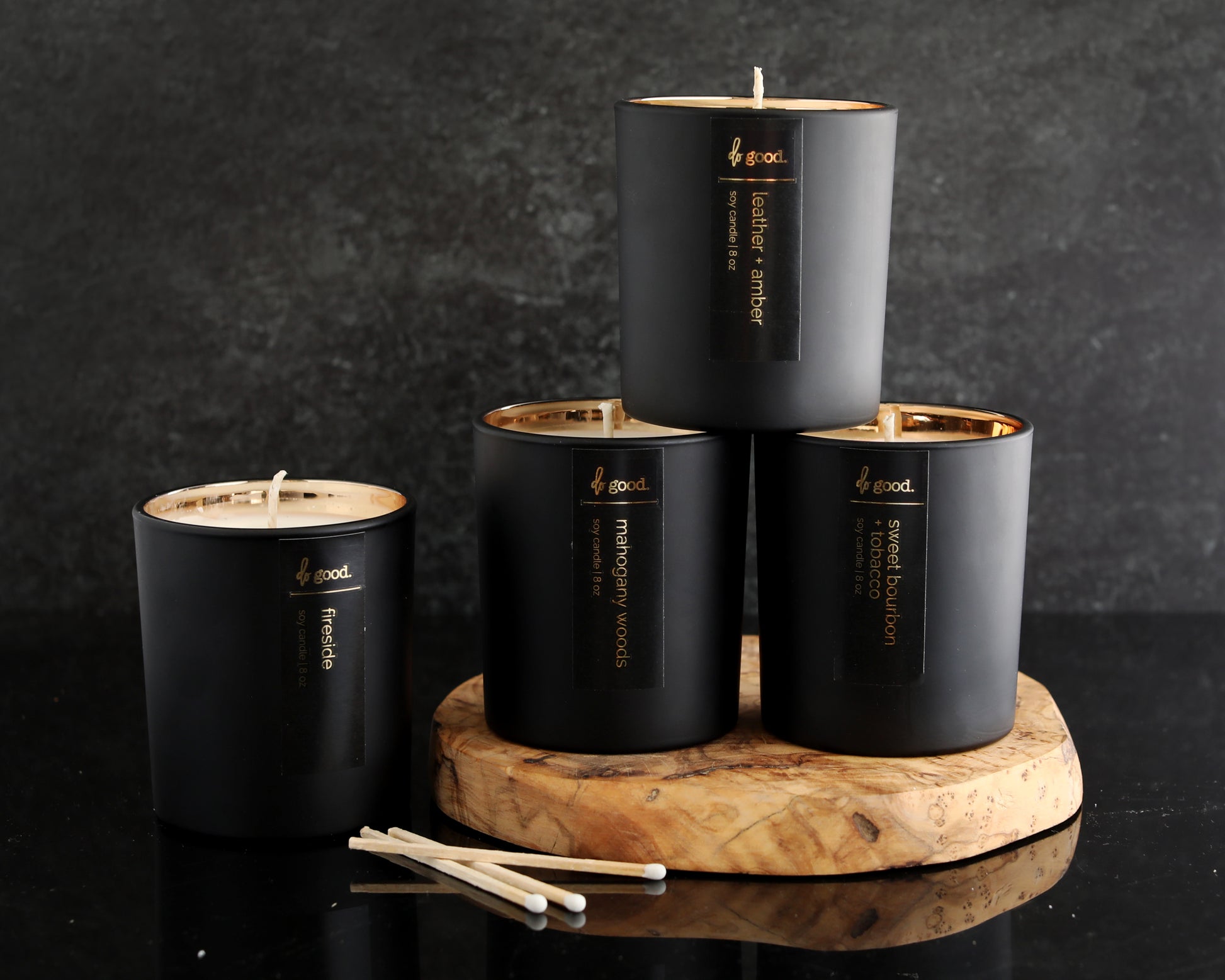 four candles in luxe collection pictured together
