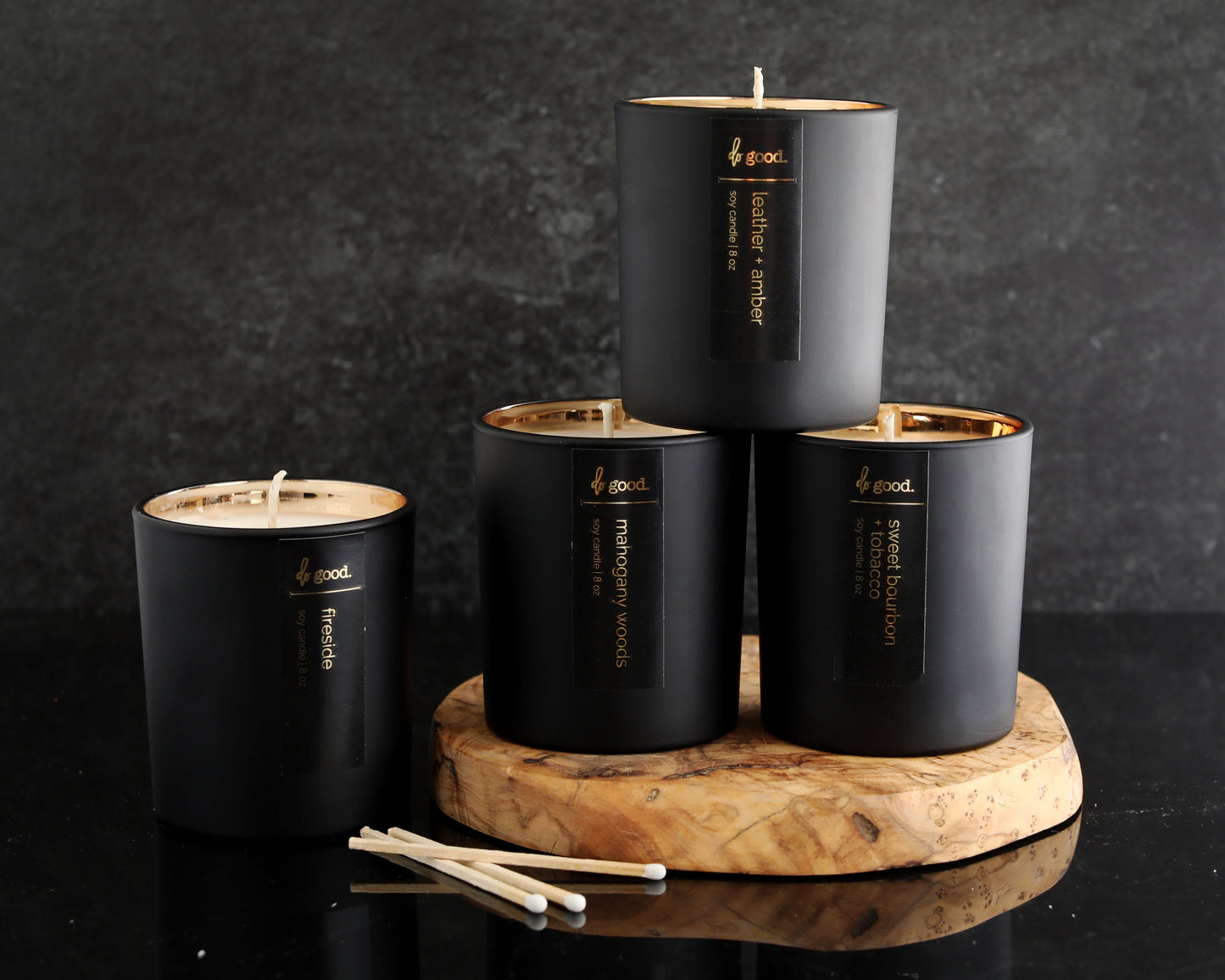 four candles pictured together in the luxe collection